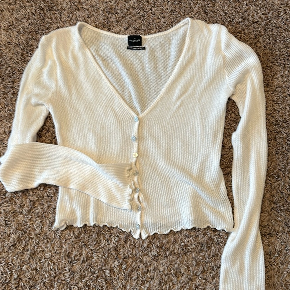 White out from under cardigan